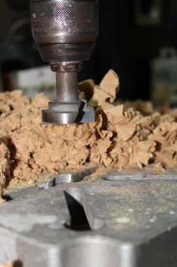 Close-up of a wooden Mill surrounded by chip