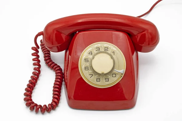 Teléfono Rojo Antiguo Aislado Sobre Fondo Blanco Imagen de archivo