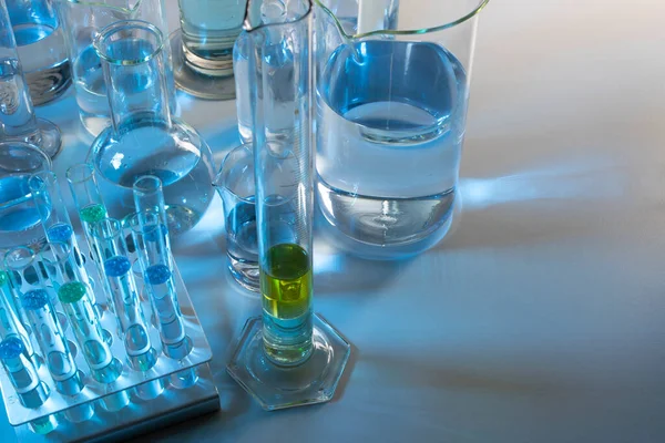 Laboratory Equipment Beaker Flask Cylinders Test Tubes Bluish Light — Stock Photo, Image