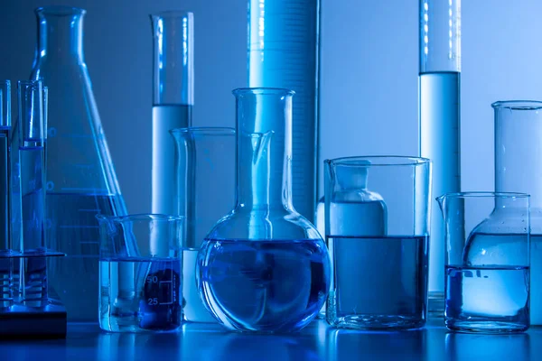 Laboratory Equipment Beaker Flask Cylinders Test Tubes Bluish Light —  Fotos de Stock