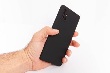 El ele tutuşan cep telefonu ve şablon reklamcılığı ve markalaştırma teknolojisi için boş ekran. İnce çerçeveli ve boş beyaz ekran izole edilmiş gerçekçi akıllı telefon modeli. Herhangi bir kullanıcı arayüzü testi veya sunumu için kullanılabilir.