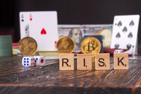 Word risk with poker accessories and bitcoin. — Stock Photo, Image