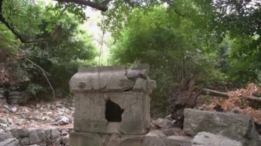 Cracked old stone figure close up.