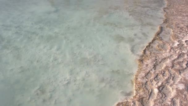 Transparent clear water in natural travertine pool close up. — Video