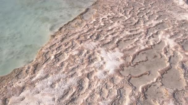 Calcium carbonate mineral. Close up of travertine pool with clear hot water. — 图库视频影像