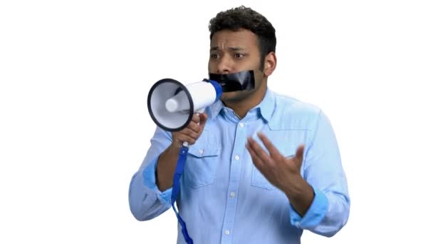 Young angry man with taped mouth can not speak — Stock Video