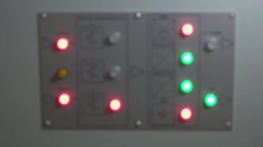 Hand pressing the button on the electrical switch gear.