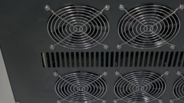 Close-up black panel of computer radiator coolers.