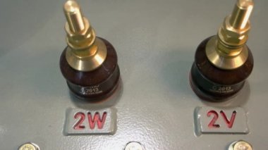 Close-up industrial machine valves for voltage regulation.