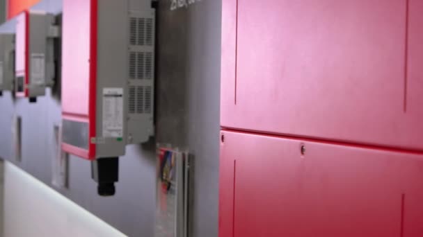 Perspective view of red electrical boxes indoors. — Stok video