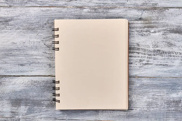 Blank notepad for copy space on gray wooden desk. — Stock Photo, Image
