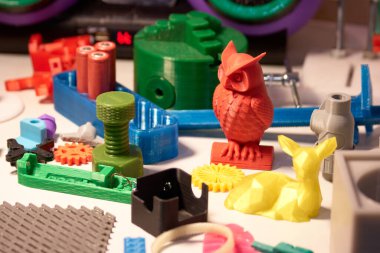Collection of bright colorful objects printed on a 3d printer.