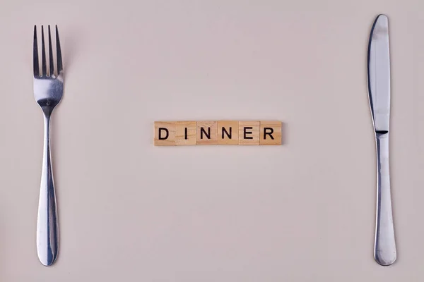 Dinner Inscription Wooden Blocks Fork Knife White Background Flat Lay — Stock Photo, Image