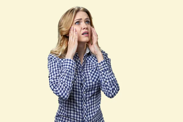 Stressed Young Woman Touching Her Face While Standing White Background — Stockfoto