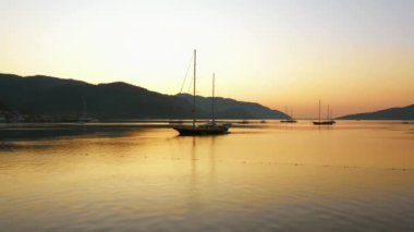 Sea bay with yachts and mountains at sunset. Scenic evening landscape. Marmaris, Turkey.