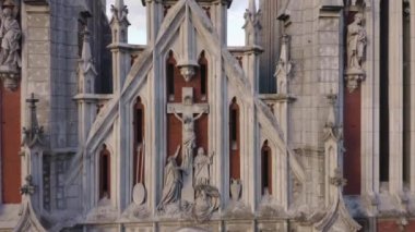 Gothic Cathedral of St. Nicholas in Kyiv. Roman Catholic Church with Jesus Christ on the cross.