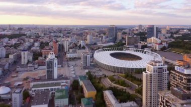 Aerial view of evening urban cityscape with olympic stadium. Kiev city from above.