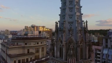 Evening cityscape and St Nicholas Roman Catholic Church of St Nicholas. Kiev city and sunset sky.