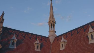 Decorative roof of The Roman Catholic Church of St Nicholas in Kiev. Blue sky background. National House of Organ and Chamber Music.