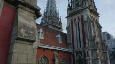 Old ancient historical decorative Roman Catholic Church in Kiev. Close-up elder architecture building.