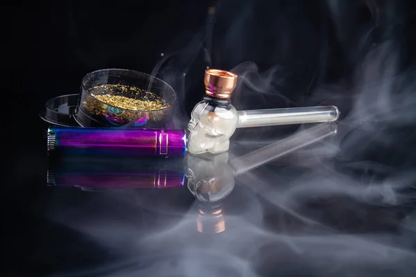 Cool smoking pipe with weed and a lot of thick white smoke. Mj cannabis smoking concept.