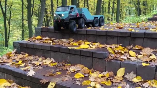 Flatbed Towing Truck Going Downstairs Park Toy Vehicle Autumn Park — Stockvideo