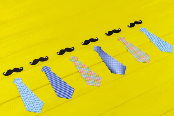 Mens Neckties Moustaches Yellow Desk Fathers Day Concept — Stock Photo, Image