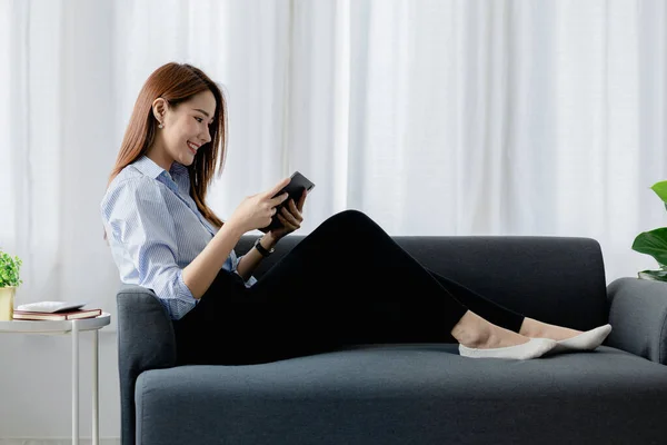Woman Plays Tablet Sofa Her Living Room Home She Resting — Stock Photo, Image