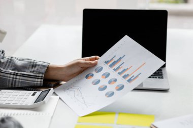 Business women are looking at the company's financial documents to analyze problems and find solutions before bringing the information to a meeting with a partner. Financial concept.