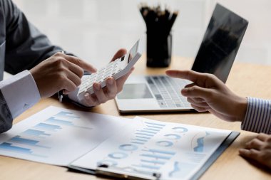 Atmosphere brainstorming session of a startup company, two founders of the company attended a meeting to plan the management and financial growth of the company. Management startup company concept.