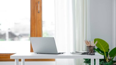 Startup company desks, empty offices, office spaces in marketing staff's offices, desks with office equipment for work, window desks, Meeting rooms in startup companies. Office desk placement ideas.
