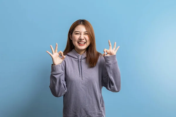 Portrait Beautiful Asian Woman Doing Cheerful Pose Isolated Blue Background — Stockfoto