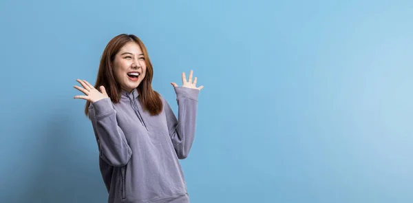 Portrait Beautiful Asian Woman Doing Cheerful Pose Isolated Blue Background — Stockfoto