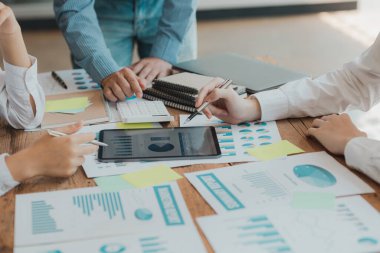 Business man group are meeting together in the office, they are meeting on the topic of finance and financial management, they are business partners. Concept financial management for startup companies