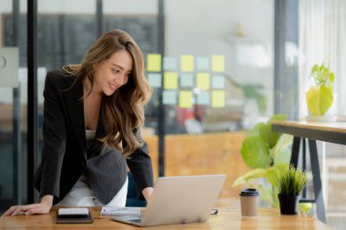 Beautiful Asian woman is a businesswoman who leads a new generation of startups, a woman who runs and manages a business plan to build confidence and stability in business, woman-led business concept.