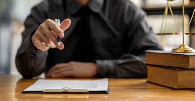 Client was listening to a lawyer advising on an embezzlement case, explaining the details of the proceeding and gathering evidence to file a lawsuit against the defendant. The concept of litigation.