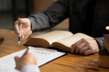 Client was listening to a lawyer advising on an embezzlement case, explaining the details of the proceeding and gathering evidence to file a lawsuit against the defendant. The concept of litigation.