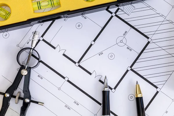 Close-up of building plans designed by architects, architect engineers design houses and interior structures and draw plans through design programs. Architect concept of building design.