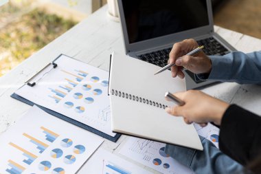 Atmosphere brainstorming session of a startup company, two founders of the company attended a meeting to plan the management and financial growth of the company. Management startup company concept.