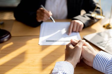 Client was listening to a lawyer advising on an embezzlement case, explaining the details of the proceeding and gathering evidence to file a lawsuit against the defendant. The concept of litigation.