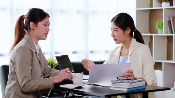 Two Women Sitting White Papers Talking Two Business Women Discussing — стоковое видео