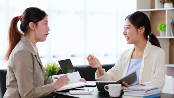 Two Women Sitting White Papers Talking Two Business Women Discussing — Video Stock