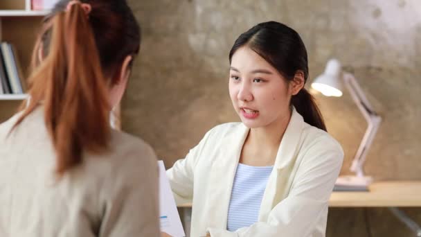 Two Women Sitting White Papers Talking Two Business Women Discussing — Wideo stockowe