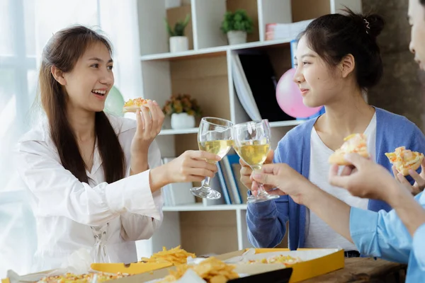 Group of young Asians having fun at company parties, startup parties, new year parties, annual company parties, alcoholic beverages. Company employee party catering ideas, celebrations.