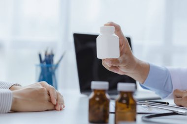 Doctors are giving advice on medication to patients in hospital examination rooms, treating diseases from specialists and providing targeted treatment. Concepts of medical treatment and specialists.