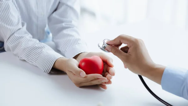 Doctor Uses Stethoscope Fake Heart Patient Hand Treating Disease Medical — Fotografia de Stock