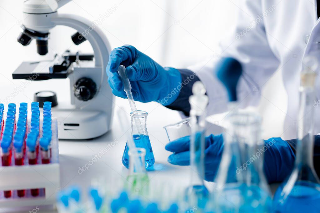 Laboratory assistants are investigating chemical reactions, medical scientists, chemical researchers, chemical experiments and disease testing from patient blood samples. Medicine and research concept