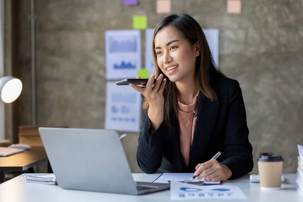 Beautiful Asian woman executives, business executives, marketing executives are talking on the phone with customers to contact the company for marketing. Marketing management concept.