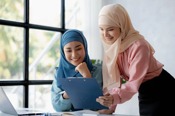 Two Hijab Clad Asian Women Brainstorming Together Conference Room Startup — Zdjęcie stockowe