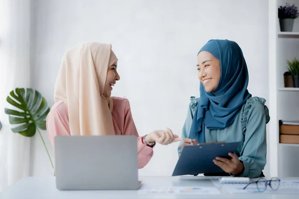 Two Hijab Clad Asian Women Brainstorming Together Conference Room Startup — Zdjęcie stockowe